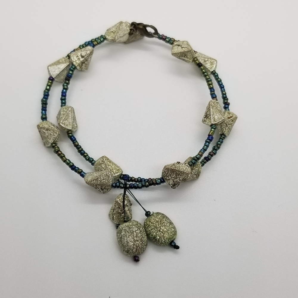 oil slick seed beed and silver wrap bracelet